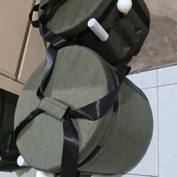 Verified buyer photo of the purple and olive padded carrying case included with the set